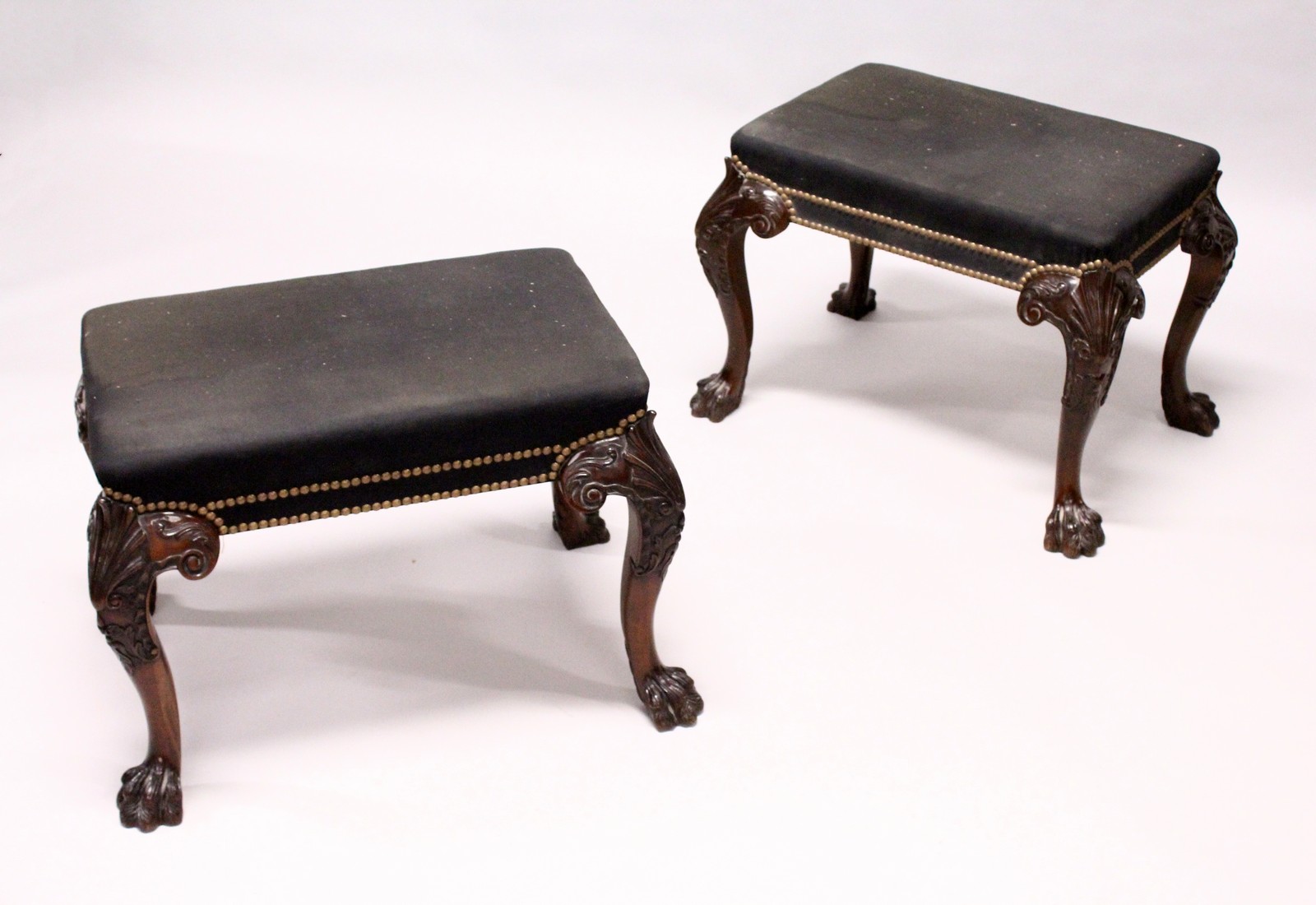 A GOOD PAIR OF GEORGE III DESIGN MAHOGANY RECTANGULAR STOOLS, with brass studded black cloth