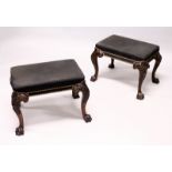A GOOD PAIR OF GEORGE III DESIGN MAHOGANY RECTANGULAR STOOLS, with brass studded black cloth
