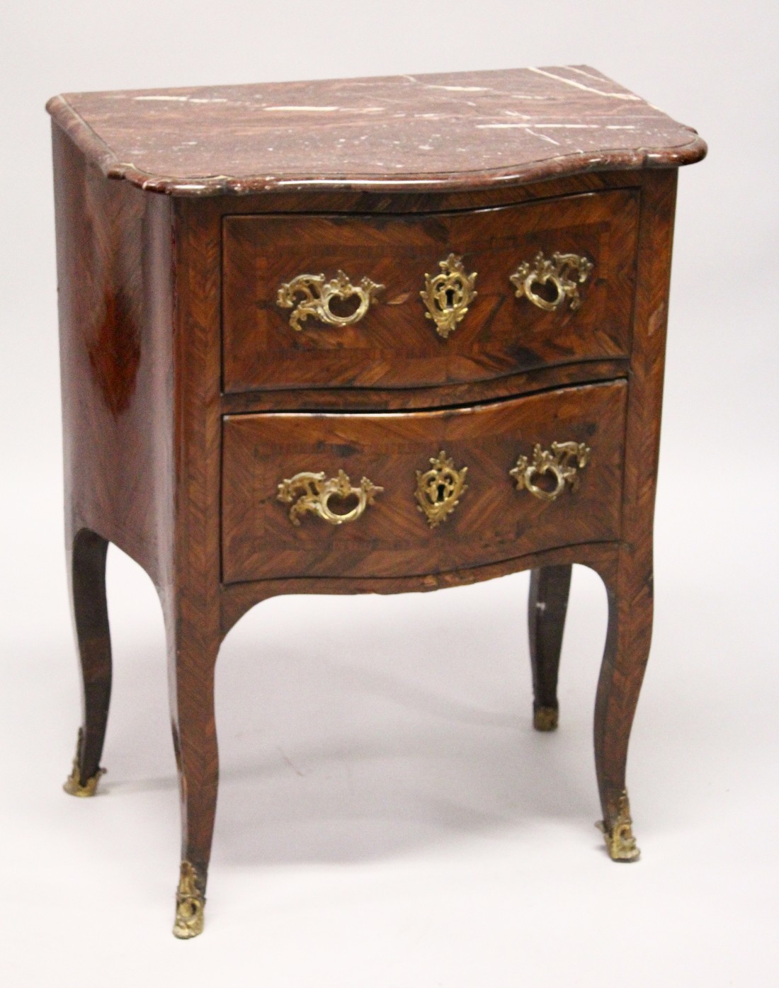 AN 18TH CENTURY FRENCH KINGWOOD, ORMOLU AND MARBLE TWO DRAWER SERPENTINE PETIT COMMODE, the shaped