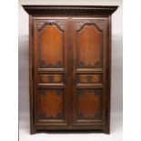 A GOOD LARGE 19TH CENTURY FRENCH OAK TWO DOOR ARMOIRE, with a dentil moulded cornice, a pair of