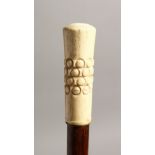 A 19TH CENTURY WALKING CANE with engraved ivory handle 37ins long