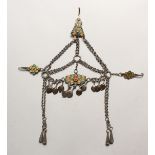 A HEAVY ISLAMIC SILVER AND ENAMEL HEAD PIECE.