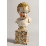 A GOOD PRATTWARE BUST OF O YOUNG BOY ON A PEDESTAL 11ins high.