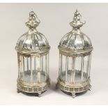 A PAIR OF CIRCULAR SHAPED SILVER METAL HANGING LANTERNS 24ins high.