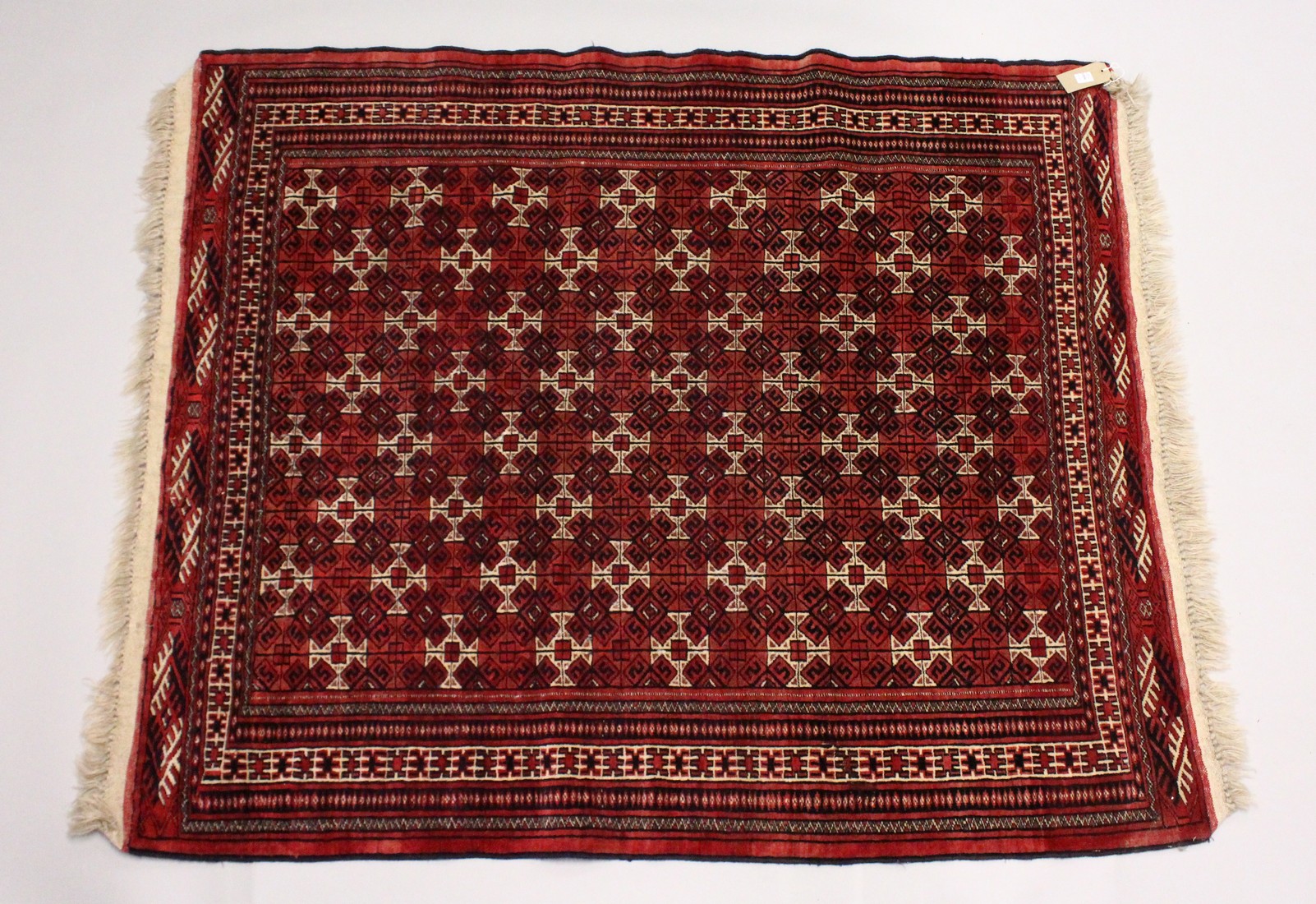 A TURKOMEN YAMUD CARPET, red ground with all over geometric design. 5ft 10ins x 4ft 8ins