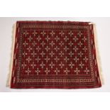 A TURKOMEN YAMUD CARPET, red ground with all over geometric design. 5ft 10ins x 4ft 8ins