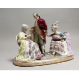 A LARGE 19TH CENTURY GERMAN PORCELAIN GROUP, a gallant and two ladies sitting in arm chairs. 9ins