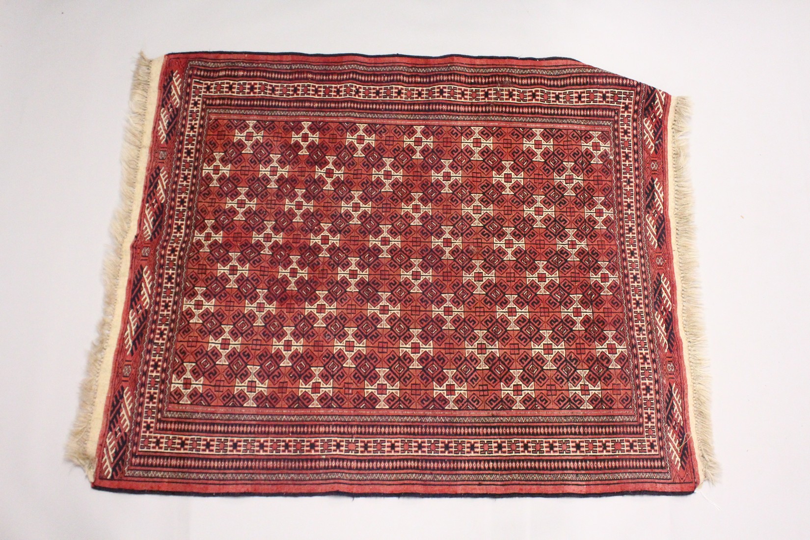 A TURKOMEN YAMUD CARPET, red ground with all over geometric design. 5ft 10ins x 4ft 8ins - Image 2 of 2