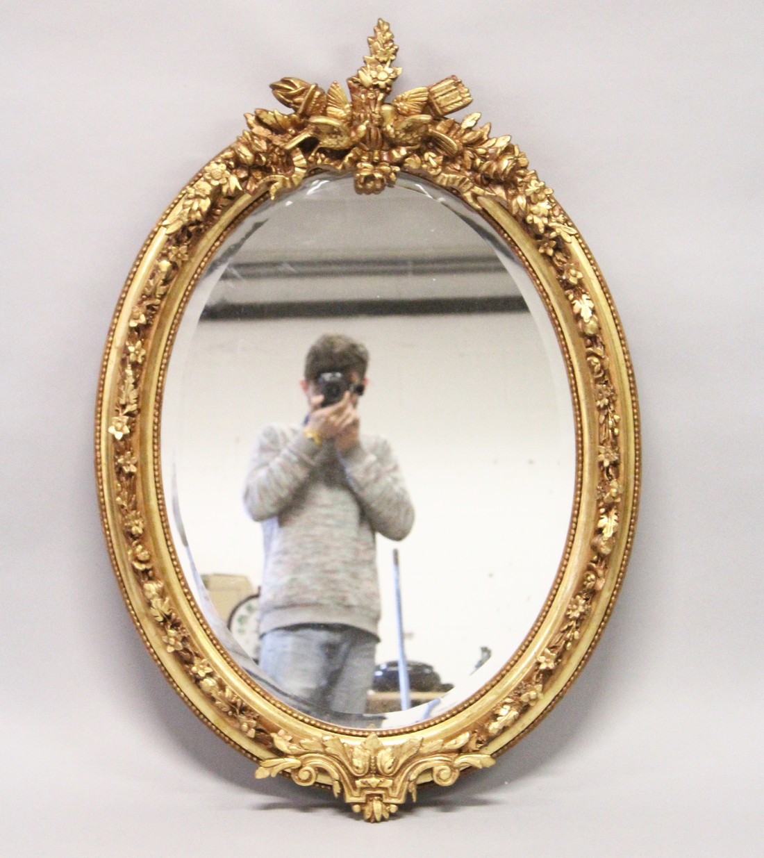 A DECORATIVE GILT FRAMED OVAL WALL MIRROR 3ft 7ins high x 2ft 6ins wide - Image 2 of 5
