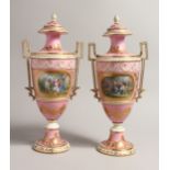 A VERY GOOD PAIR OF 19TH CENTURY SEVRES URN SHAPED TWO HANDLED VASES AND COVERS with rose