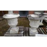 A GOOD PAIR OF ITALIAN CARVED WHITE MARBLE URNS , the sides carved with dancing muses 2ft 6ins high