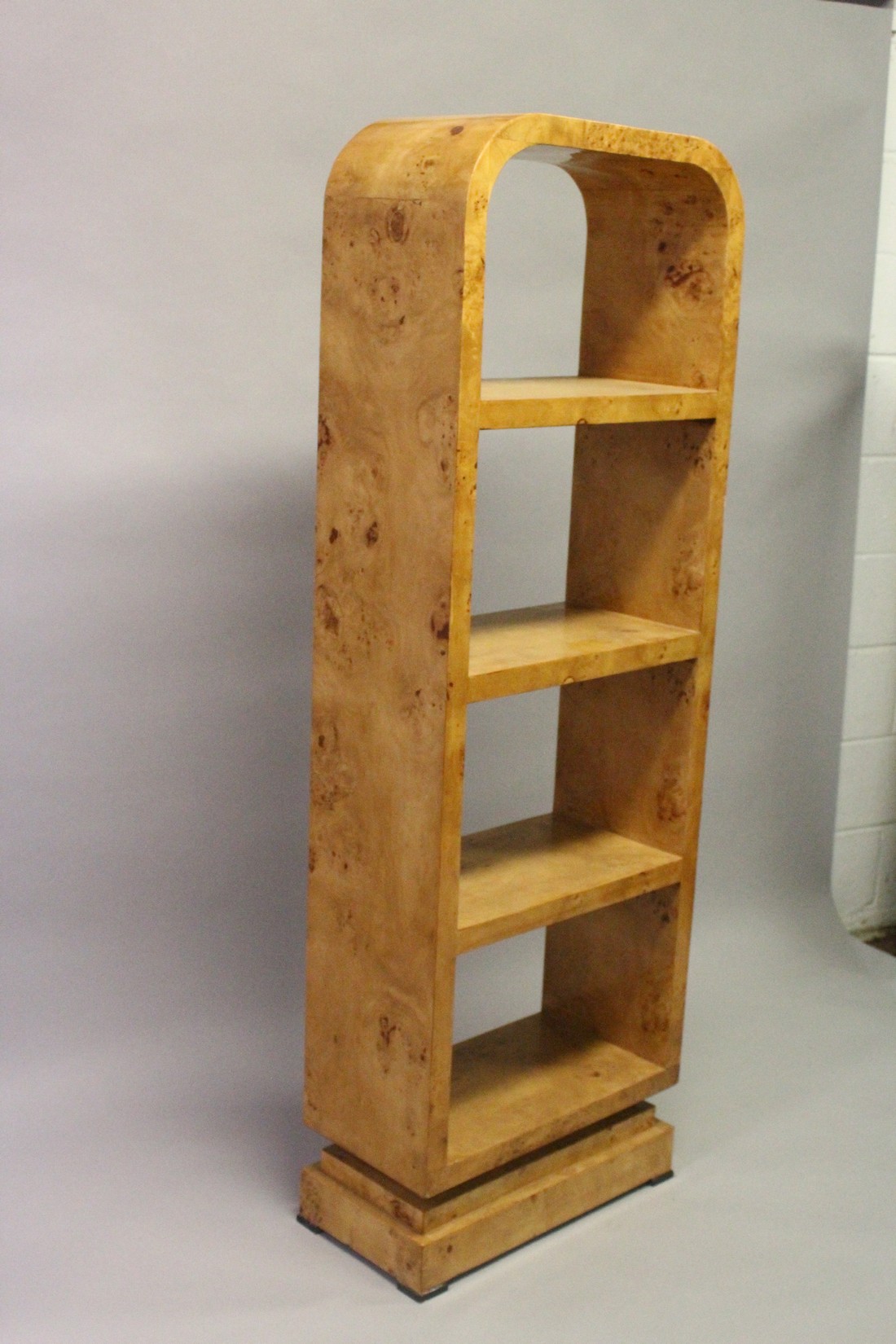 AN ART DECO STYLE BURR WOOD FREE STANDING OPEN BOOKSHELF, with four shelves on a platform base. - Image 2 of 3