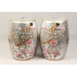 A PAIR OF CHINESE PORCELAIN BARREL SEATS, silvered ground decorated with birds and flowering