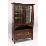 AN ART NOUVEAU MAHOGANY INLAID CHINA CABINET with a pair of leaded glass doors over an open space,