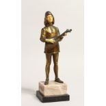AN ART DECO GILT BRONZE AND BONE YOUNG MAN playing a mandolin, on an onyx base. 10.5ins high