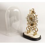A VERY GOOD BRASS SKELETON CLOCK striking on a simple bell with glass dome 16ins high.