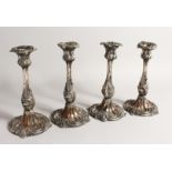 A SET OF FOUR 19TH CENTURY ROCOCO STYLE CANDLESTICKS 9INS LONG