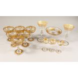 A GOOD SET OF SIX GILDED CHAMPAGNE GLASSES with ribbon motif and garlands along with three liqueur