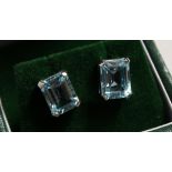 A PAIR OF SILVER TOPAZ EMERALD CUT EAR RINGS