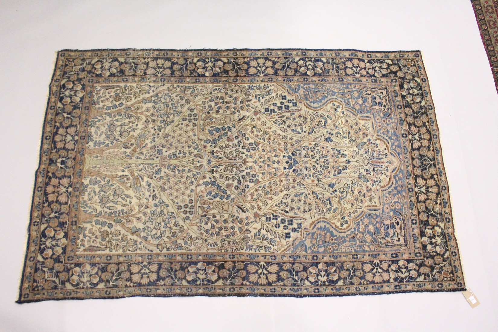 A PERSIAN KERMAN CARPET, cream groud with a stylised tree design. 7ft x 4ft 5ins - Image 2 of 2