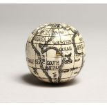 A SMALL BONE FOLDING GLOBE COMPASS.