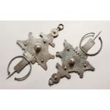 A SMALLER PAIR OF ISLAMIC SILVER HEAD PIECES