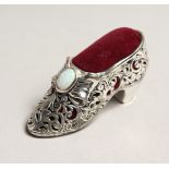 A NOVELTY SILVER SHOE PIN CUSHION.