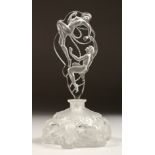 A GLASS SCENT BOTTLE AND STOPPER IN THE LALIQUE STYLE. 8.5ins high.
