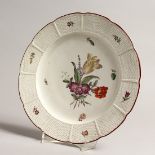 AN 18TH - 19TH CENTURY LUDSWIGBURG LATTICE PLATE white ground painted with flowers. 9ins diameter,