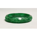 A CARVED APPLE GREEN BANGLE