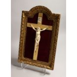 A GOOD ITALIAN CARVED IVORY CORPUS CHRISTI on a velvet background and gilt frame.