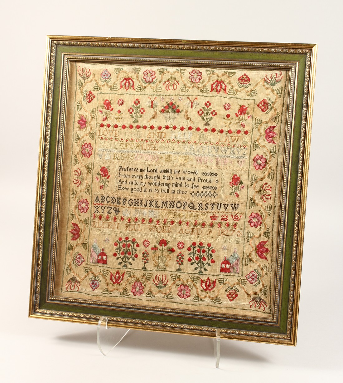 A GEORGE IV FRAMED AND GLAZED SAMPLER by Ellen Bell, Aged 9, 1827. 17ins x 6ins