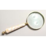 A MAGNIFYING GLASS with mother of pearl handle.