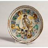 AN ITALIAN MAJOLICA PEDESTAL LOW TAZZA with cupid design. 8.5ins design