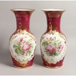 A GOOD PAIR OF LARGE 19TH CENTURY FRENCH PINK GROUND VASES with gilt decoration and painted with a