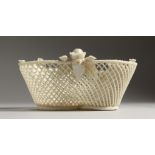 A BELLEEK PORCELAIN TREFOIL SHAPED PIERCED BASKET 5.25ins wide.