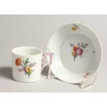 A 19TH CENTURY MEISSEN COFFEE CUP AND SAUCER painted with flowers. Septre mark in blue