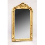 A LARGE ORNATE GILT FRAMED ARCH TOP MIRROR, the top with moulded leafwork decoration. 5ft high x 2ft