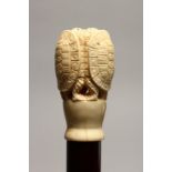 A NOVELTY WALKING STICK WITH CARVED BONE HANDLE, modelled as group of three turtles 35.5ins high.