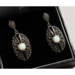A PAIR OF SILVER OPAL AND ONYX DECO STYLE EAR RINGS