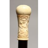 A NOVELTY WALKING STICK with carved bone handle, modelled as a mermaid 36ins high.