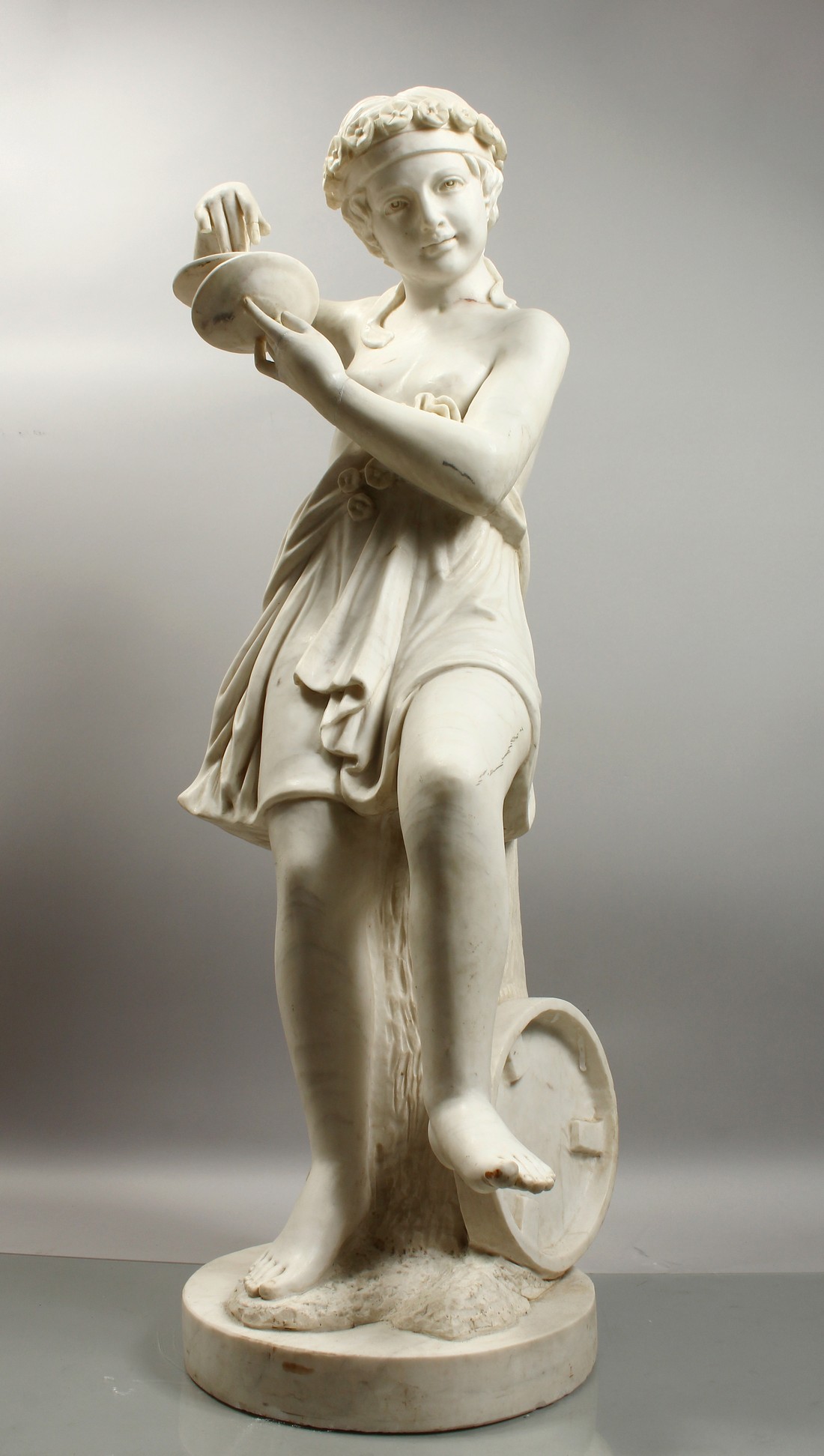 A GOOD LARGE ITALIAN CARVED CARRERA MARBLE, CHILD PERSONIFYING MUSIC, carved as a young female