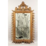 A DECORATIVE PIER MIRROR, 20th Century with a pagoda style cresting and leaf carved frame. 4ft