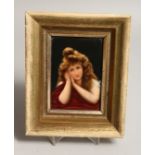 A GERMAN PORCELAIN MINIATURE OF A YOUNG LADY 5ins x 3.5ins in a gilt frame.