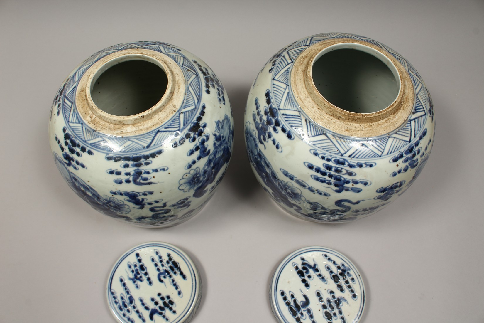 A PAIR OF CHINESE BLUE AND WHITE PORCELAIN JARS AND COVERS, painted with lion dogs 12.5ins high. - Image 5 of 8