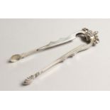 A PAIR OF SILVER TONGS