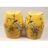 A PAIR OF CHINESE PORCELAIN BARREL SEATS, yellow ground, decorated with birds on flowering