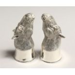 A PAIR OF .800 SILVER PLATED HORSE'S HEAD SALT AND PEPPERS