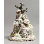 A LARGE 19TH CENTURY GERMAN PORCELAIN GROUP, boy and girl with a lamb, with encrusted with flowers