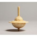 A CARVED BONE SPINNING TOP 2ins